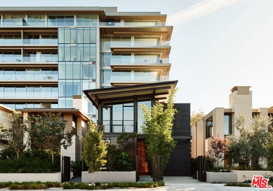 Wood House at 8899 Beverly. Olson Kundig. West Hollywood luxury presides at 8870 Rosewood Avenue where incredible resort amenities meet architectural brilliance. This exceptional home is part of a unique collection of eight signature homes crafted by the world-renowned architect Olson Kundig, each boasting a distinctive material palette and a one-of-a-kind living experience. Wood House prioritizes natural materials to create restorative spaces that balance bold and soft. The result is an extroverted character, moderated by an undercurrent of Japanese Zen garden influence. From the cantilevered roof to the exposed steel frame, every detail of Wood House is a nod to bold innovation, tempered by tranquility. The charred shou sugi ban siding adds a touch of drama, while the light interior palette ensures a sense of serenity pervades throughout. Sophisticated yet welcoming in design, the interior boasts wood floors, Lutron HomeWorks QS System lighting, and Fleetwood glazed doors and windows. The main floor offers an office with views of the landscaping. The gourmet kitchen features top-of-the-line Gaggenau and Miele appliances, light-stained white oak cabinetry, and custom paneling. A custom stairwell with open-riser wood treads and exposed steel curates an artful transition from level to level. Upstairs, the primary suite includes a private balcony adorned with a woven-wire mesh guardrail and wood decking, providing a tranquil retreat to unwind and admire the views of the Hollywood Hills and Pacific Design Center framed by floor to ceiling windows. The ensuite bathroom has full stone flooring and walls made of Statements Crema Ella marble. Outside, find a Japanese Tea House inspired garden curated by Coen + Partners, a pool, sealed cumaru decking and a guest house with separate bath. The signature collection deftly blends individuality and privacy with exceptional resort lifestyle amenities. 8899 Beverly Boulevard - Olson Kundig's "Love Letter to Los Angeles" - offers residents access to 24-hour concierge service, a state-of-the-art fitness center, and a lushly landscaped oasis with a resort-style pool, spa, a custom outdoor kitchen, and an on-site restaurant, Stella. Experience the epitome of luxury urban living in West Hollywood. Contact us for a private viewing today.