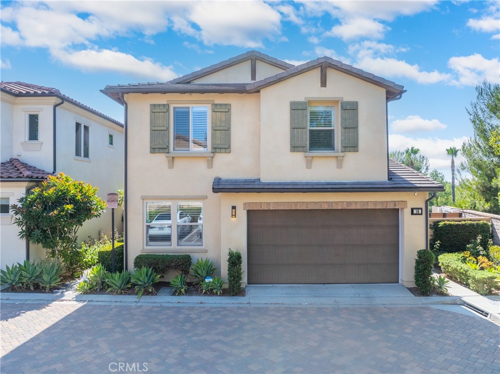 Very desirable property Located on a Premium, Oversized Private Lot in the resort-style Baker Ranch community! This Gorgeous Upgraded Single-Family Home includes 4 Bedrooms one conveniently located on the ground floor and 3 Bathrooms. Home blends Ideal Indoor/Outdoor Living with a Gorgeous Open Floor Plan! This is the first time this Premium Corner View Lot with a private 3,142 sq. ft. Enjoy stunning sunset and greenbelt views from both the backyard and the primary suite. The residence boasts engineered hardwood floors and a custom oak staircase. A new modern electrical fireplace serves as a custom-built centerpiece in the living space, providing warmth and style. The laundry room features a new custom-built barn door while the master bedroom has a glass barn door that enhances its luxurious feel as your private retreat. The kitchen is a chef's paradise, featuring a granite island, countertops, and backsplash with new kitchen appliances and a sensor-operated kitchen hood. The home is bright, with LED recessed lighting throughout. The kitchen and bathroom faucets have been updated to black-themed fixtures, and each bathroom is adorned with tastefully framed mirrors. The fully upgraded garage features custom-built extensive cabinetry, including a giant slide-out shoe cabinet, a soft water system, epoxy flooring, and a Nema 40 amp plug for electric vehicle charging. Modern connectivity with app-connected garage door, main door, and thermostat. The home also boasts a fully paid-off 5.6kW Tesla solar panel system, contributing to energy efficiency. Step outside to a state-of-the-art landscape design, architecturally crafted into four zones for fun, dining, or relaxation. The oversized, custom-built pergola with retractable shades ensures outdoor comfort in all weather. TimberTech composite decking is perfect for outdoor dining and accented with spot LED lighting. Modern water fountain with LED lighting creates a stunning nighttime display. The backyard is enclosed with a tempered glass fence wall, providing a seamless view of the beautiful surroundings. The community offers many swimming pools and clubhouses, central parks, playgrounds, a dog park, and BBQ areas all within walking distance. Conveniently located near many retail stores in the Foothill Town Center. A short drive to Irvine Spectrum, a 20-minute to Laguna Beach, UC Irvine. High Ranking Saddleback Valley Unified Schools. This is a Special House on a Special Lot without Mello Roo's and low HOA due.