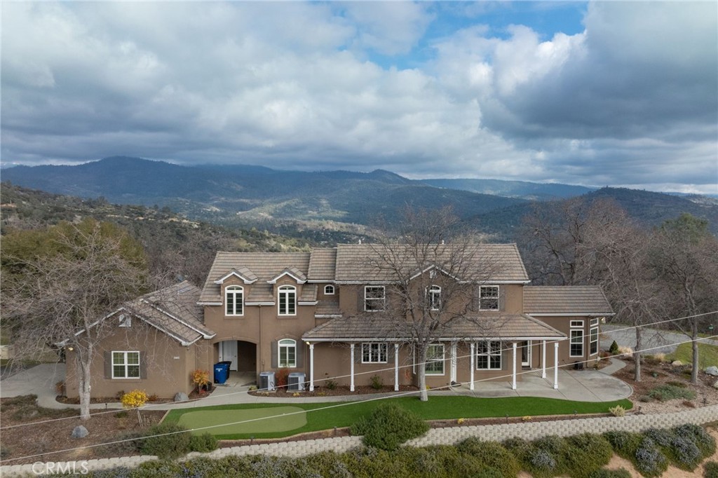Discover luxury and comfort in this custom-built home, offering over 4,200 sq. ft. of living space designed for both relaxation and entertainment. Enjoy breathtaking panoramic views from nearly every room in the house.
This home features 4 spacious bedrooms, an office, game room and 2 wet bars, providing ample space for work and leisure. The open-concept layout seamlessly blends style and functionality. With paid solar, an automatic whole-house generator and fiber optic internet underground you'll have energy efficiency and peace of mind year-round.
The attached 3-car garage and ample parking make hosting guests effortless. Step outside to your own private putting green, perfect for golf enthusiasts or simply unwinding in the fresh air.
Located in a prime setting with unmatched views, this home is truly one of a kind. Don't miss out—schedule your private showing today!
Section 1 has been completed & mountain panel is in supplements!