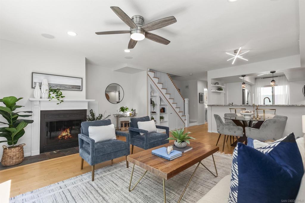 Completely remodeled and move-in ready, this Point Loma residence blends modern upgrades with timeless coastal convenience. The kitchen showcases granite counters and a bar that opens to the dining and family rooms. All three bathrooms were recently redone—both upstairs ensuite baths taken down to the studs, one with a jetted tub/shower combo and the other with a full-size shower, plus a first-floor powder room with custom tilework and pedestal sink. A new custom hardwood staircase and railing provide enhanced safety and striking design. Other highlights include hardwood flooring on the main level, gas fireplace, built-in ceiling speakers in the family room, recessed lighting, upstairs laundry, and a unique custom under-stair storage system. System upgrades include a new energy-efficient HVAC with smart thermostat and all-new dual-pane windows and sliding glass door. The private fenced patio is ideal for outdoor dining or gardening. Gated garage parking includes an oversized private storage room. With no neighbors above or below, this turnkey home offers the feel of a detached residence just minutes from beaches, Liberty Station, Downtown, and the airport. The kitchen was thoughtfully upgraded with custom cabinetry featuring pull-out drawers for maximum function and storage. Both ensuite bathrooms were rebuilt down to the studs with custom tile, glass enclosures, and new ventilation—one with a jetted tub/shower combo and the other with a full-size shower—while the powder room was redone with new tile, a pedestal sink, and ventilation. A brand-new custom hardwood staircase and handrail replaced the original, providing both safety and design impact. Additional enhancements include new recessed lighting, newer carpet upstairs, fresh interior paint, and a custom-built under-stair storage system designed specifically for this home with three pull-out sections. Outdoor improvements feature a private fenced patio with pavers, added outlets, and new exterior lighting. Systems were upgraded with a brand-new energy-efficient heat pump/HVAC with smart thermostat and all-new dual-pane windows and sliding glass door.