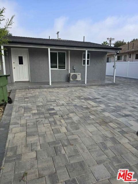 Photo of 14123 Califa Street, Van Nuys, CA 91401 (MLS # 25613871)