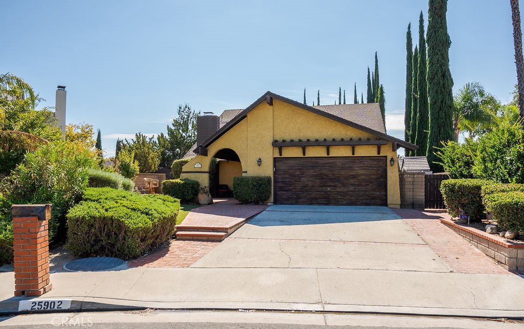 This beautifully updated Valencia home is designed for comfort, convenience, and California living. Offering 5 bedrooms and 3 full baths across 2,289 sq. ft., it sits on a generous 10,256 sq. ft. lot with a sparkling pool and plenty of outdoor space. The bright, open layout is highlighted by vaulted ceilings, a cozy fireplace, and versatile living areas perfect for entertaining or relaxing. The kitchen features ample cabinetry, quartz-style counters, and easy flow to dining and family spaces, while multiple sliders and a covered patio make indoor-outdoor living effortless. Upstairs bedrooms provide plenty of flexibility for families, guests, or a home office. The primary suite includes direct access to outdoor space, with potential to create a sunny retreat or café-style nook. Practical features include a 2-car attached garage, fenced yard with shed, and central cooling. The neighborhood of Valencia is known for its rolling terrain, family-friendly atmosphere, and excellent schools within the William S. Hart Union High and Newhall School Districts, including Foothill High. Community highlights include parks, shopping, dining, and convenient freeway access. This is a rare opportunity to own a spacious home with both character and potential in one of Valencia’s most sought-after areas.