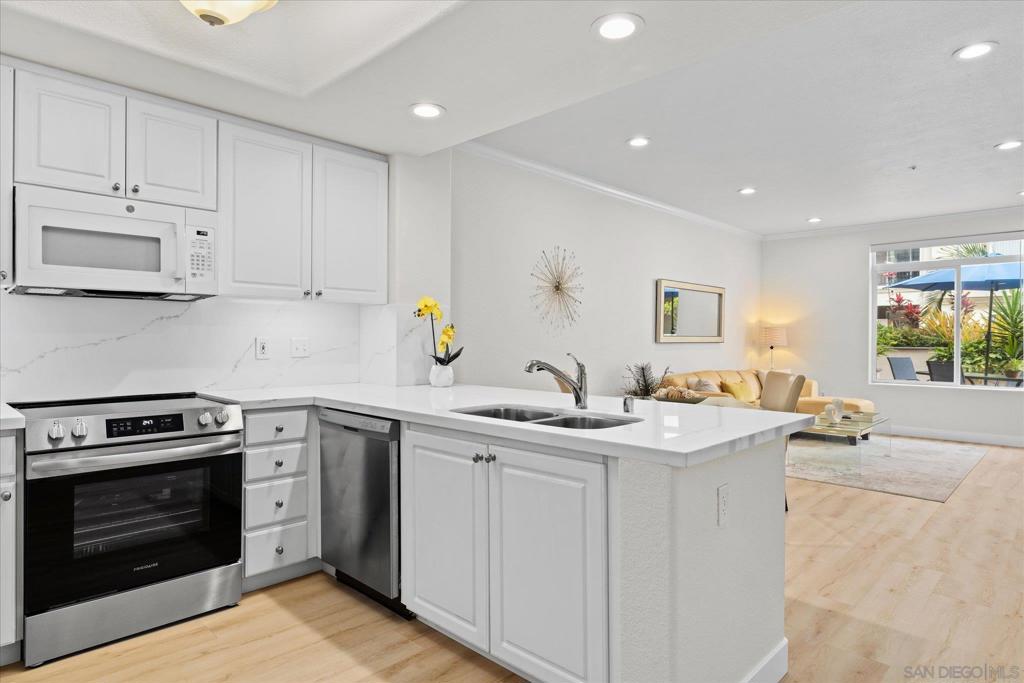 Welcome to the luxury resort style Regents La Jolla. This stunning and highly upgraded ground-level home offers an ideal accessible location with a spacious private patio perfect for enjoying San Diego’s sunshine. The light and bright interior features an open floor plan, recessed lighting, luxury vinyl plank flooring throughout, fresh paint, and quartz kitchen countertops with a stylish backsplash. The kitchen includes new stainless steel appliances, and the fully remodeled bathroom offers a new tub, floor-to-ceiling tile, and updated plumbing. Turn-key and move-in ready—don’t miss this rare opportunity! Welcome to this beautifully remodeled corner unit in the highly desirable luxury resort-style Regents La Jolla condominium. This ground-level home offers an ideal location with easy access and a spacious private patio perfect for enjoying San Diego’s sunshine. The light and bright interior features an open floor plan, recessed lighting, luxury vinyl plank flooring throughout, fresh paint, and quartz kitchen countertops with a stylish backsplash. The kitchen includes new stainless steel appliances, and the fully remodeled bathroom offers a soaking tub, floor-to-ceiling tile, and updated plumbing throughout. This luxury gated community complex has amazing amenities such as Concierge services, business center with printers and wi-fi, 2 heated pools, 2 spas, tiki bar w/BBQ, SPA, clubhouse, theater, gourmet kitchen with formal dining room, game room, gym, cabanas, and much more... Perfect location within minutes to the UCSD, UTC mall and amazing restaurants, easy access to the frewways and the beautiful beaches. Don't miss this rare opportunity on this turn-key and move-in ready property!