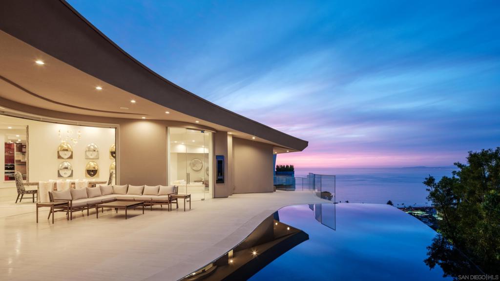 Nestled on the hills of La Jolla, Villa Luna offers panoramic views from La Jolla Shores to Del Mar. This premier home is designed for ultimate comfort and exclusivity, featuring a private infinity pool, hot tub, indoor fireplaces, outdoor fire pit, and a gym. Enjoy a steam shower, soaker tub, 4-zone AC, Sonos Wi-Fi speakers, and an EV charger for your convenience. With 5 spacious bedrooms, each with its own en suite, this villa ensures complete privacy for all guests. Additional features include a private office, wine cellar, security cameras, and 4 parking spaces (2-car garage + 2 driveway). Villa Luna is fully furnished and available for 1-week to 12-month rentals. Whether you’re here for a short getaway or a long-term stay, this home provides the perfect blend of luxury and comfort.