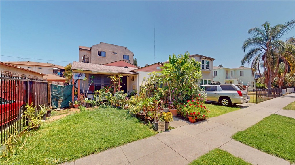 Prime Investment Opportunity With High Income in a Desirable Long Beach Location. Don't miss this chance to own this high performing 4+ units in one of most sought-after neighborhood. This well-maintained quadruplex offers strong rental income and an unbeatable location, ideal for both investors and first time buyers. The front building is a stand-alone home with its own front-yard and driveway, perfect for an owner-user or premium tenants. The rear structure is a three-level building. The ground level includes a secured parking garage for all units and a convenient in-house laundry room. The second and third floors each provides two spacious units, for a total of 4 additional units. Each units has two bedrooms and one and half bathrooms, generous living space, open kitchen, and sliding doors to a private balconies. Most units are in excellent condition, providing immediate rental income with minimal up-keep.