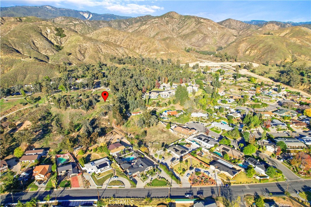 Welcome to 1640 Bonita Vista Dr! Perched along the scenic foothills, this property is strategically elevated to offer unparalleled, breathtaking views that stretch across the horizon. Picture waking up to stunning sunrises and enjoying tranquil evenings with the city lights twinkling below. Here, you'll experience a perfect blend of exclusivity and serenity.
This is truly an exceptional canvas for your dream home in San Bernardino, CA. This expansive vacant lot spans an impressive 19,580 sq ft, providing a universe of possibilities to create the residence you've always envisioned.
The vastness of the lot allows for endless outdoor possibilities, from lush gardens to elegant outdoor living spaces where you can fully immerse yourself in the natural beauty of the foothills.
This is more than just a piece of land; it's an opportunity to build a sanctuary that embodies the essence of elevated living. Schedule a viewing today and embark on the journey to create your dream home. Act swiftly – opportunities like this are rare and won't last long.