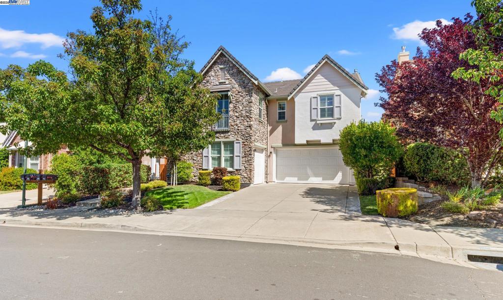 Located in the highly sought after Monterosso neighborhood with views of Mt. Diablo and no rear neighbors! Highly upgraded interior features including a built-in Kitchen Aid refrigerator, wine refrigerator, 8' arched paneled doors, plantation shutters, tile and carpet flooring, stone kitchen counters and center island, updated kitchen appliances, gas fireplace, and an upstairs laundry room with additional cabinet storage. Includes formal dining and living rooms, a kitchen/family combo, and an upstairs loft accented with arches. Equipped with central A/C and forced air heating, both with 2+ zones. The backyard is designed for entertaining with artificial turf, gas fire pit, a custom outdoor kitchen island with a built-in gas BBQ, 2-burner stove, and refrigerator. Features a 3-car garage with custom cabinets, 240V outlet for EV charging and epoxy flooring. Built in 2007 and is well-maintained. Located within the highly-rated San Ramon Valley Unified School District, with easy access through a backyard gate to Diablo Vista Middle School.
