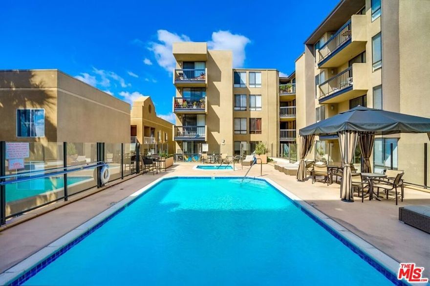 Classy and Fully updated sleek Condo in Hollywood!  Perfectly located in the heart of Hollywood/Sunset Strip at the Hollywood Regis building, this FULLY RENOVATED JNR/1BA home is fully equipped for easy and comfortable living. Step inside to find an open floor plan with premium finishes, fabulous natural light, stunning hardwood floors, a designer color scheme, and a spacious living room. Entertain guests and mix drinks in the open concept kitchen featuring quartz countertops, stainless-steel appliances, dishwasher, sleek ample white cabinetry, gas cook-top, built-in microwave, track lighting, and an adjacent dining room with double glass soundproof sliding glass doors to the spacious balcony. Sit on the balcony and sip cocktails with friends while admiring the fabulous views of downtown Los Angeles. Discover relaxing evenings in the NYC loft style bedroom, which has a large walk-in closet with your own washer and dryer, Separate  bathroom w/storage vanity and a shower/tub combo and separate vanity area. For a fit lifestyle, enjoy the community amenities of a sparkling heated swimming pool, hot tub, sun deck w/cabanas, and a fitness ceneter! Other features: 1-covered and secured parking space, onsite management, security fob on all entries, close to Runyon Canyon, shopping, chic restaurants, the Hollywood Bowl and more! Easy living LA style, the perfect pied- a -terre, first home or LA city pad, this little gem is a must see!