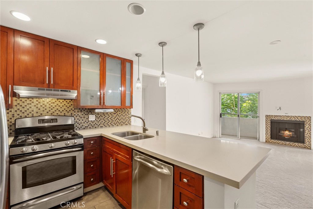 Welcome to this beautifully cared for 2-bedroom, 2-bathroom condo nestled in one of Sherman Oaks' most desirable neighborhoods. Located just moments from Ventura Boulevard, this bright and spacious unit offers the perfect blend of comfort, style, and convenience. Step inside to find an airy open-concept living and dining area ideal for entertaining or relaxing at home. The kitchen features granite countertops, stainless steel appliances, and plenty of cabinet space for all your culinary needs. The generously sized bedrooms are well positioned on opposite sides of the unit, with the primary suite offering a large closet, a private en-suite bathroom and access to the balcony. The second bedroom has a large walk-in closet and is perfect for guests, a home office, or a growing family. Additional highlights include in-unit laundry, central A/C, and 2 private balconies for morning coffee, evening wine, or taking in the SoCal weather. The secure, well-maintained building includes gated parking, a sparkling pool, and a fitness center. With easy access to the 101 and 405 freeways, top-rated schools, shops, dining, and entertainment, this is the perfect place to call home. Don’t miss this rare opportunity to live in one of LA’s most sought-after communities!