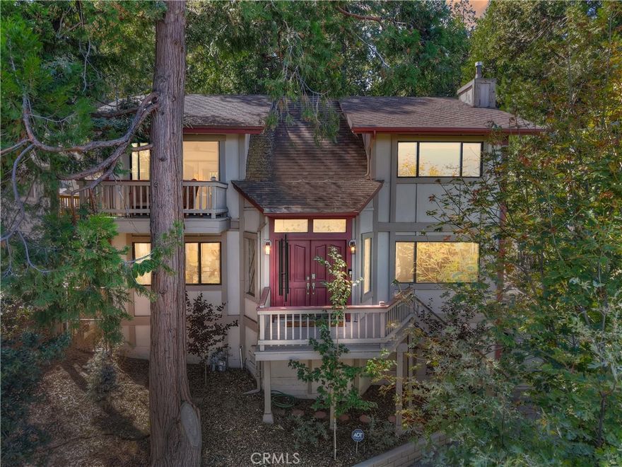 Beautifully Remodeled San Moritz Area Home with a Huge Oversized Garage & Stunning Views, Tastefully Upgraded to Seamlessly Blend Top-of-the-Line Finishes with Luxury, Warmth, & Mountain Charm! The property backs to acres of Thousand Pines Camp land and features a fully fenced, terraced, and highly usable yard offering both privacy and a lush forest backdrop. A gated driveway with remote control provides peace of mind, while the large gentle driveway allows ample parking and convenient level-entry access directly into the main level of the home. Inside, the main level features a stunning chef’s kitchen with custom cabinetry, quartz countertops, beveled subway tile backsplash, stainless steel appliances, coffee bar, and a large center island. The kitchen flows seamlessly into a spacious dining area that opens directly to the covered back patio, perfect for entertaining or quiet mornings. An open living room and separate family room—both with distant ridgeline views—are filled with natural light that flows gracefully throughout the day, creating an ever-changing warmth and ambiance. The family room is anchored by a cozy gas fireplace and warm T&G wood ceilings, while a powder room, laundry room, and welcoming foyer with dramatic vaulted T&G wood ceilings and handcrafted oak stairway complete the main level. Upstairs, the spacious primary suite is a tranquil private retreat, featuring a seamless glass walk-in shower with elegant tilework, custom vanity cabinetry with built-in shelves, dual sinks with quartz countertop, and a private deck with amazing ridgeline views. Two additional generously sized bedrooms include a guest room with stunning mountain vistas and abundant natural light. A versatile loft serves as a bright workspace/office nook with a built-in desk, overlooking the tree-scaped backyard and forest beyond. Completing the upstairs is a beautifully appointed full guest bath with custom vanity and quartz countertop combining function with refined style. The oversized 720-square-foot garage provides abundant storage, a half bath, hardwired plug/circuit for a backup generator—perfect for a workshop, hobby space or potential ADU. Custom cabinetry, quartz counters, updated plumbing fixtures, new water heater & new high efficiency furnace, luxury vinyl floors, and plush carpet complete the home. This exquisitely remodeled home combines luxury, warmth, and mountain serenity with picturesque surroundings. Experience it in person and make it your own!