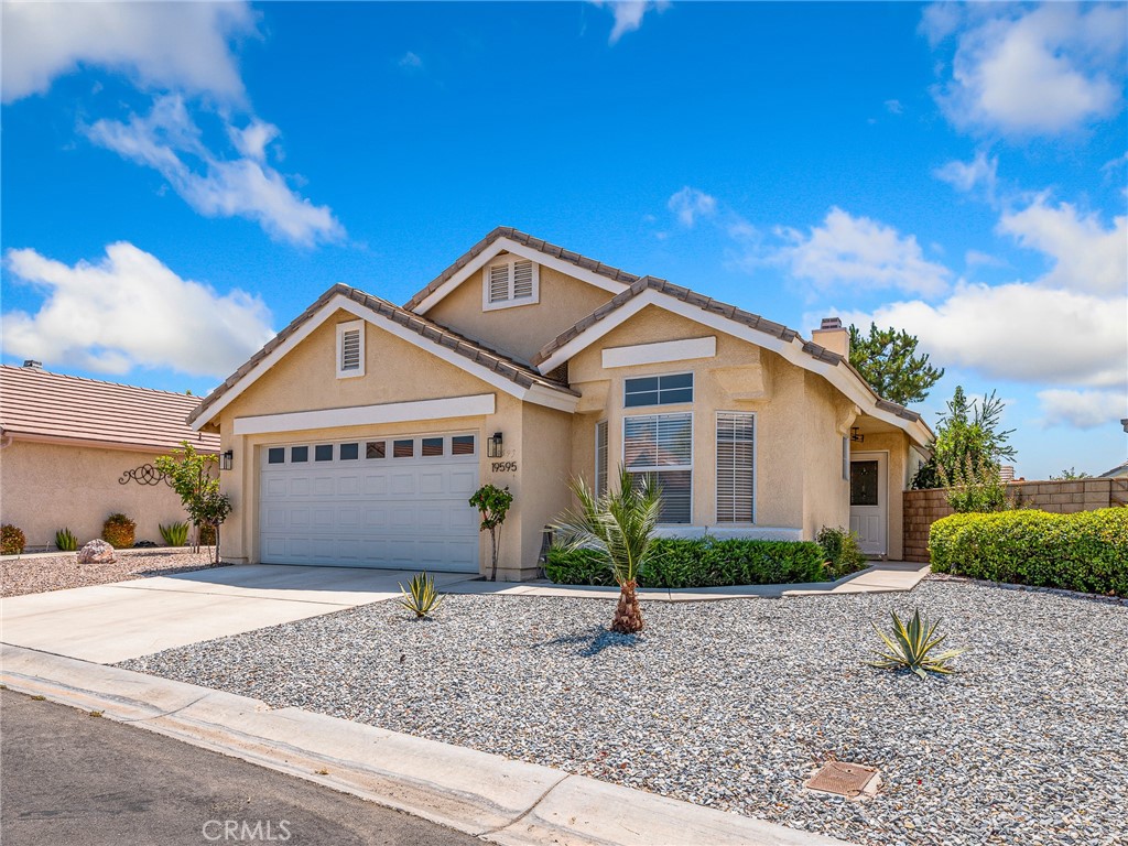Welcome to this stunning 2-bedroom, 2-bath home in the desirable Wyndham Rose neighborhood of the 55+ Jess Ranch Community.
Step inside this fully renovated beauty and you’re immediately greeted by brand new laminate flooring throughout, all new paint throughout, all new window coverings, all new stylish lighting fixtures, and modern ceiling fans in both the living room and primary suite.
The living and family rooms share a beautifully tiled, cozy double-sided fireplace, perfect for relaxing evenings. The light and bright kitchen has been completely transformed with quartz countertops, freshly painted cabinets with contemporary hardware, new stainless steel appliances, a large pantry, a small office workspace, and a French door leading to a convenient service porch.
The spacious primary suite boasts a lovely bay window and a French door opening to a covered patio with peaceful greenbelt views and walking path access—perfect for pet owners. The primary bath features a soaking tub, a custom-tiled shower with a contemporary glass shower door, a quartz double-sink vanity, contemporary faucets, designer lighting, a skylight, and a huge walk-in closet.
The second bedroom is equally inviting, with its own bay window and generous closet space. The updated second bath includes a contemporary glass shower door, quartz vanity, and modern finishes.
Additional highlights include a laundry area with new cabinetry, a 2-car attached garage with a workbench and storage, a serviced HVAC system, and an exterior refresh with a serviced tiled roof, Cool Roof Coating on the patio, repainted trim, new fencing and gate, decomposed granite for easy maintenance, and new landscaping with trees and decorative rock.
Enjoy the beauty and convenience of greenbelt views, a walking path right outside your door, and a move-in ready home that truly shines. THIS IS ONE YOU MUST SEE. PREPARE TO FALL IN LOVE!