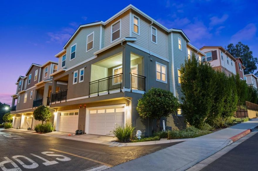 Beautifully crafted townhome, built in 2016, offers modern living in the desirable Villages at Arnold. Some images have been virtually staged! Luxury vinyl plank flooring spans the main living areas, adding style and durability. On the main level, an airy great room seamlessly integrates family, dining & kitchen spaces, perfect for entertaining. Sliding glass doors to the front patio present rolling hill views, while the chef's kitchen stands out with an oversized island with bar seating, sleek cabinetry, stainless steel appliances & a gas range. The top floor offes a private retreat, featuring a spacious primary suite with spa-like ensuite, dual sinks, walk-in closet & glass stall shower. Two additional bedrooms share a hall bath & the laundry room close by.  Conveniently located near dining, shopping & Hwy 680/ Hwy 4, this home is nicely situated close to the Concord shopping center and Downtown Martinez with coffee shops, breweries, restaurants, live music, Farmers Market, the Marina, scenic trails & highly-rated schools.