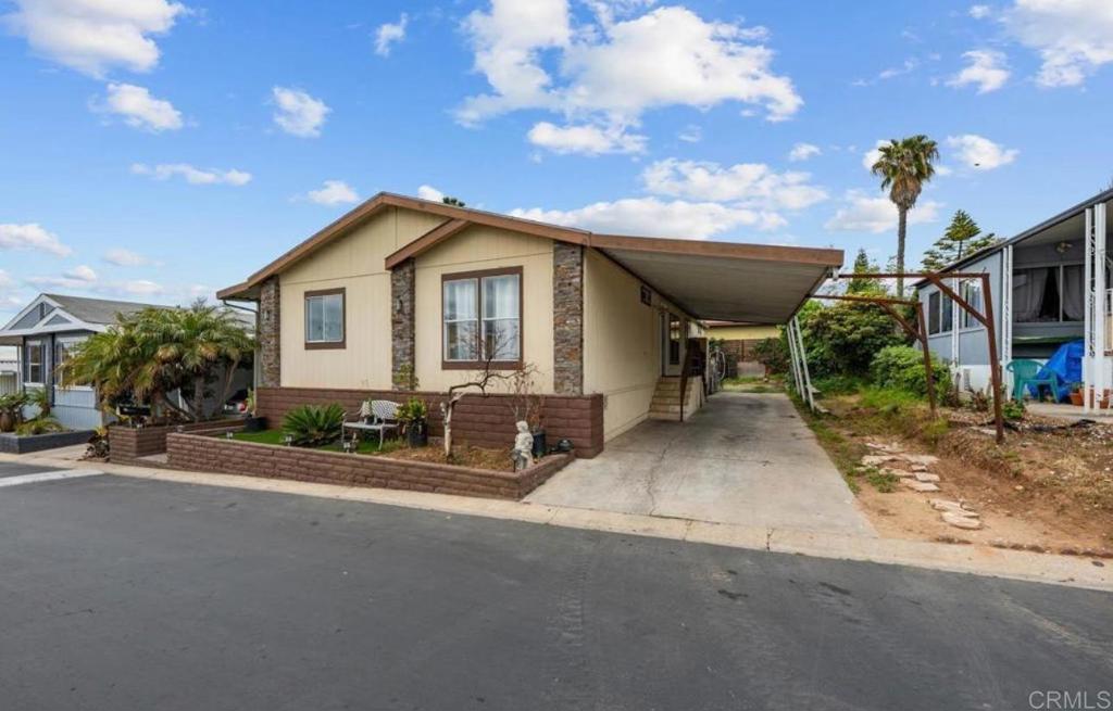 Welcome to 1011 Beyer Way #26 – Affordable Comfort in the Heart of San Diego! Discover exceptional value and convenience in this beautifully maintained manufactured home located in the sought-after Rancho Chula Vista Mobile Home Park. This charming residence offers 3 spacious bedrooms, 2 full bathrooms, and a well-designed open floor plan ideal for comfortable living and entertaining. Step into a bright and airy living area with abundant natural light, seamlessly flowing into a modern kitchen equipped with plenty of cabinetry, ample counter space, and a breakfast nook perfect for casual dining. The primary suite features a large closet and private bath with a soaking tub and separate shower. Enjoy warm San Diego evenings in your private outdoor patio space, and take advantage of a covered carport with room for two vehicles plus a storage shed for added convenience. Residents of Rancho Chula Vista Mobile Home Park enjoy access to resort-style amenities, including a sparkling community pool, spa, clubhouse, playground, and beautifully landscaped common areas. With easy access to I-5, shopping, dining, schools, and public transportation, this location offers unbeatable convenience for families and commuters alike. Space rent is affordable and the community is well-maintained, making this home a smart investment or ideal first-time purchase. Don’t miss your opportunity to own a piece of San Diego at a fraction of the cost. Schedule your private tour today!