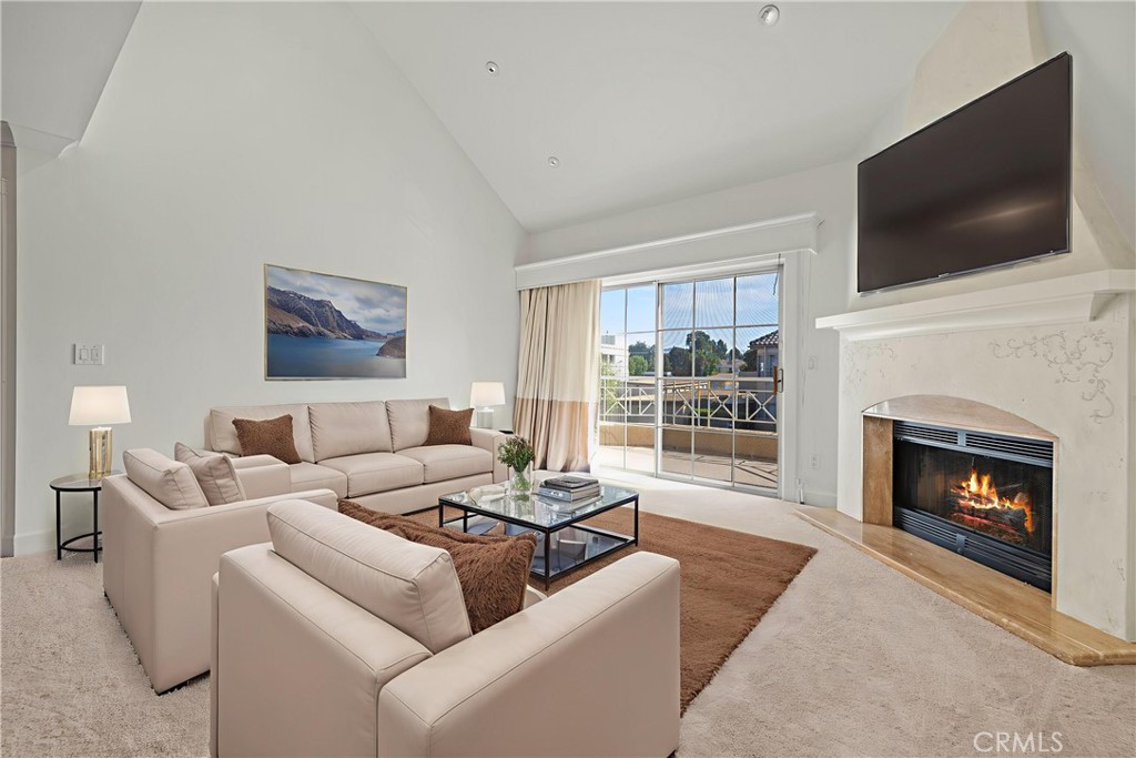 Your chance at home ownership with this MOVE-IN ready, beautifully maintained Santa Fe condo! This upper-level, corner end unit offers a spacious double primary suite layout with high vaulted ceilings, fresh paint, PLUS new carpet! The open-concept living area is filled with natural light, featuring updated kitchen and bathrooms, crown molding, recessed lighting, and a cozy custom fireplace! Both bedrooms boast walk-in closets and direct access to the private balcony—perfect for morning coffee or evening relaxation. Enjoy the convenient in-unit washer/dryer, a side-by-side two-car garage with storage racks and cabinets, plus abundant visitor parking close by! This is ideal Valencia living: a short distance from the mall, Whole Foods, Valencia Valley Elementary, Henry Mayo Hospital, and the paseo system! Washer, dryer, and refrigerator are included—making this a truly turnkey opportunity! Don't miss it!