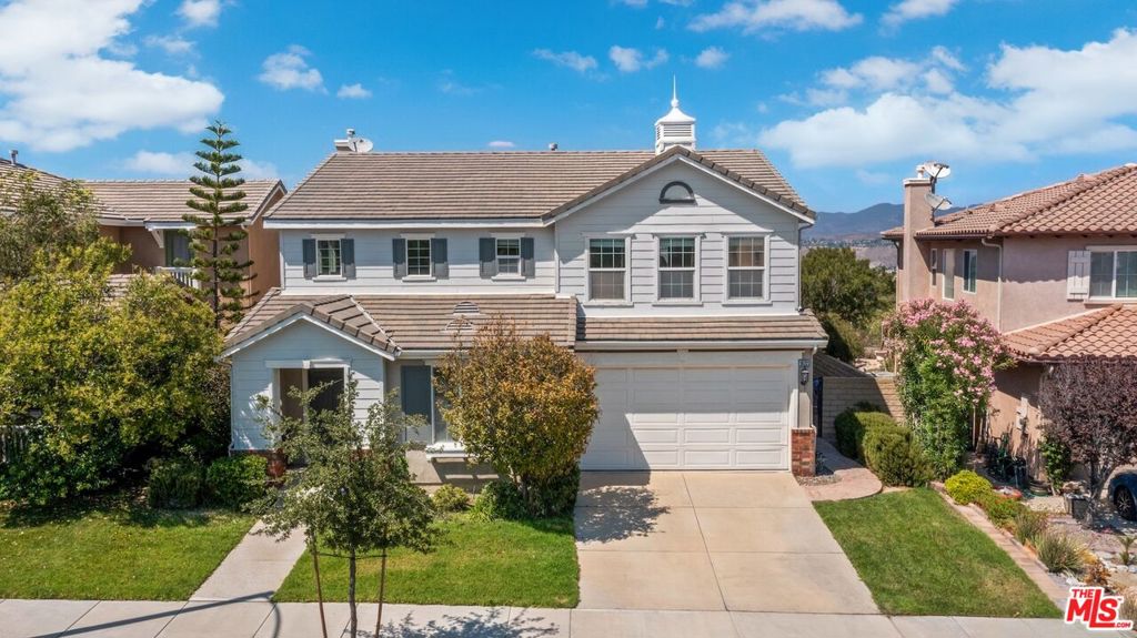 This beautiful turn-key 4-bedroom, 3-bathroom home offers new flooring, a two-story great room, high ceilings, and majestic mountain top views of the valley below. Located within the gated and patrolled community of Canyon Gate, this gorgeous retreat from the city allows you to take in nature's beauty within easy distance of all of the amenities of the city. Whether it's easy freeway access, shopping at Costco, Sam's Club, or Trader Joe's, or popping in for a cup of Joe at Starbuck's; you won't be disappointed. Welcome home to 19723 Ellis Henry Ave.