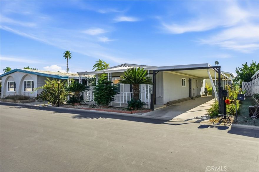 Stylishly Updated Home in the Desirable 55+ Colonial Country Club!
Step inside this beautifully refreshed 2 bedroom, 2 bathroom home offering over 1,000 sq. ft. of comfortable, modern living. A wide French front door with integrated mini-blinds welcomes you into the open living and dining area, creating an inviting flow perfect for relaxing or entertaining.

Thoughtful upgrades are found throughout, including brand-new waterproof vinyl plank flooring, upgraded light fixtures, four modern ceiling fans, and newly installed bathroom vanities that enhance the home’s clean and contemporary feel. Dual pane windows brighten the interior while improving energy efficiency. The kitchen opens into the main living area and includes a refrigerator, while the washer and dryer are also included for added convenience. A newer HVAC system and central A/C ensure year-round comfort. The property also features an irrigation system to help maintain exterior landscaping with ease.

Outside, a covered carport offers protected parking along with an additional storage shed—ideal for golf clubs, seasonal décor, or hobby equipment.

Located within the vibrant Colonial Country Club, this active 55+ community offers an incredible array of amenities: an executive 18-hole golf course, six new pickleball courts, year-round swimming pool and spa, indoor shuffleboard courts, billiards room, fitness center, ballroom, library, on-site hair salon, horseshoe pits, community laundromat, a dedicated dog park, and more. This pet-friendly community delivers true resort-style living, with shopping, dining, entertainment, and major conveniences all close by.

Discover comfort, style, and an exceptional lifestyle at Colonial Country Club!**Mobile Home Park Land Lease $999 per month**