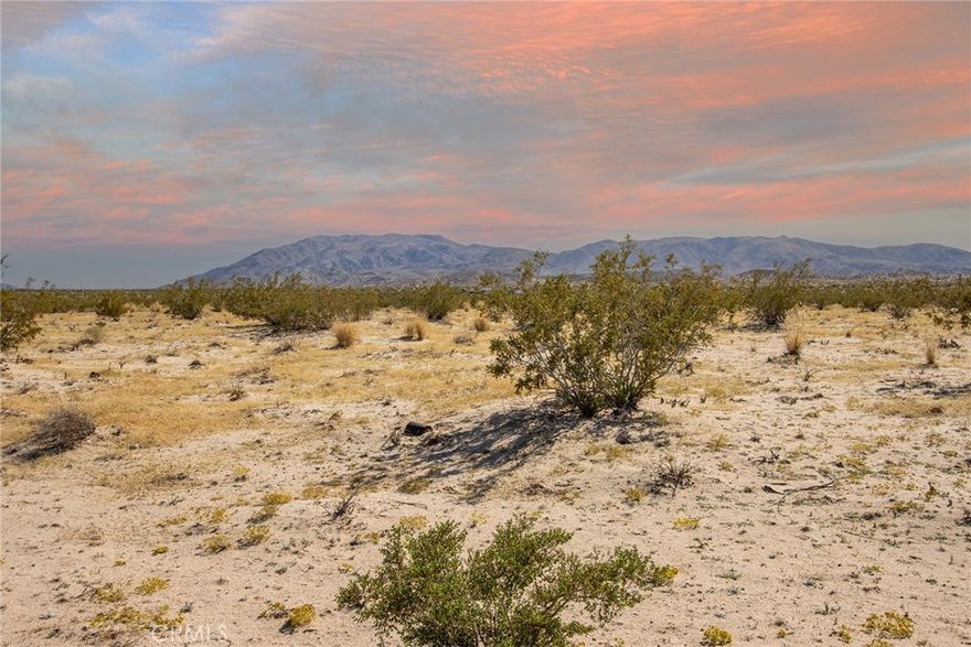 Great opportunity to own a parcel in the area of Twentynine Palms, offering 360° mountain views, dark night skies, and close access to all the essentials. Convenient location just minutes from the Joshua Tree National Park eastern entrance and downtown 29 Palms, where new shops, restaurants, and services continue to expand. Quiet setting with plenty of open space, yet close enough to town for quick access to amenities. Ideal location for those looking to secure land in a growing area of the High Desert. Buyer to verify utilities, zoning, and all intended uses. Use parcel number on LandGlide for directions - fictitious address