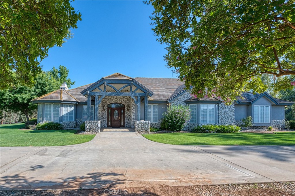 Welcome to your private oasis on just under 5 acres in Clovis! This beautifully appointed home offers space, function, and flexibility with formal dining and living rooms plus a spacious great roomideal for large gatherings or easily adaptable for your specific desires. The kitchen incudes a chef's gas range, oversized KitchenAid refrigerator, and large prep island. Each bedroom has its own en-suite bath, and the expansive primary suite features two full bathrooms and a large walk-in closet. The generously sized laundry/craft room adds practicality, while an extra water closet in the garage offers convenience. Outside, enjoy mature fruit trees, a large shop with a refrigerated area, and ample space for hobbies, storage, or projects. A rare blend of rural tranquility and luxury livingdon't miss this exceptional opportunity!