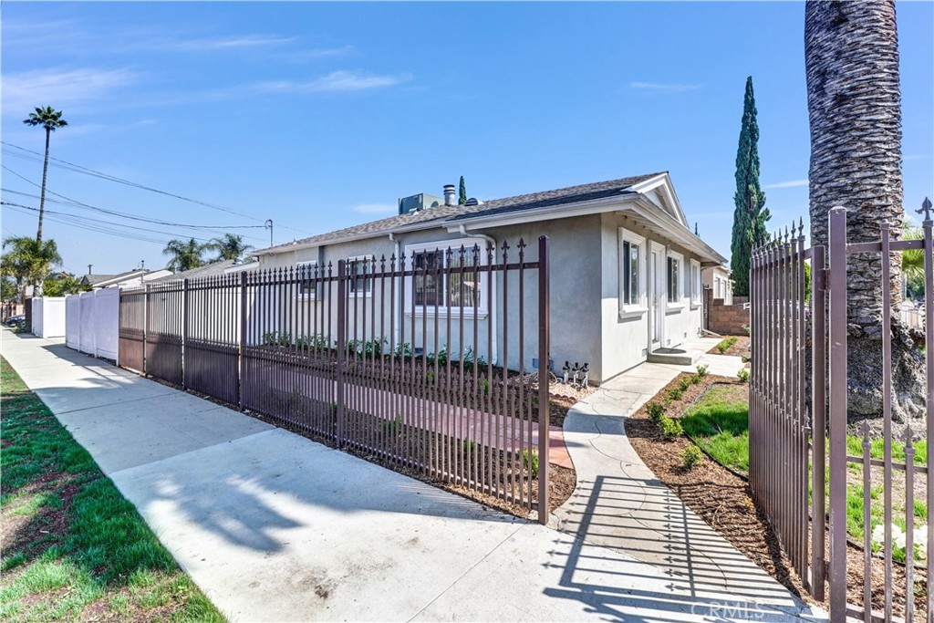 Charming 3 bedroom 2 bath corner-lot home with gleaming hardwood floors, a fireplace, and a beautiful kitchen. Relax in this private backyard retreat featuring a pool with waterfall, pool bathroom, and RV parking. Ideal location in North Hollywood!