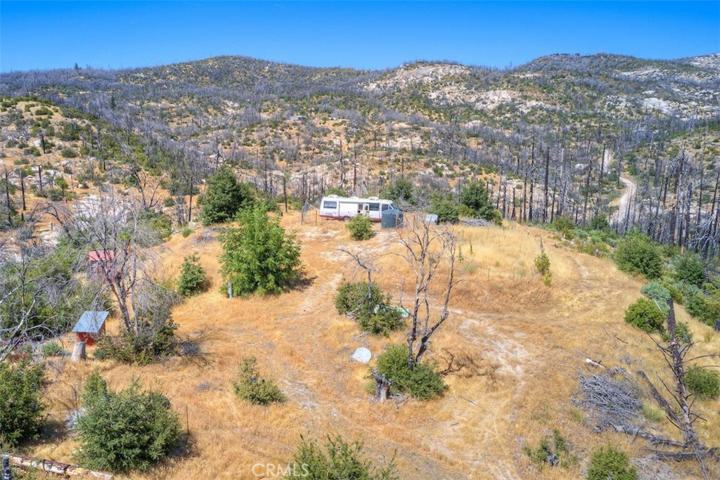 BREATHTAKING VIEWS FROM ALL AROUND...Discover the perfect foundation for your future home or investment property with this unique parcel in the beautiful Berry Creek area. This property offers a rare combination of features that add exceptional value and convenience. Situated on a serene and private setting, the land includes two septic systems, providing flexible options for building or multi-use purposes. A private well is already in place, ensuring a reliable water source, and there’s also a storage container on site, offering immediate space for tools, equipment, or materials while you build. Whether you’re dreaming of a custom home, vacation retreat, or investment project, this property provides a solid start with essential infrastructure already established. Surrounded by the natural beauty of Berry Creek, you’ll enjoy a peaceful rural lifestyle while still being within reach of Lake Oroville, recreation, and nearby conveniences.
**Buyer(s) are encouraged to investigate any/all aspects of the property to their satisfaction. Septics, well and power was in good working order prior to the 2018 Camp Fire, Buyer(s) to investigate if they are still operable if interested