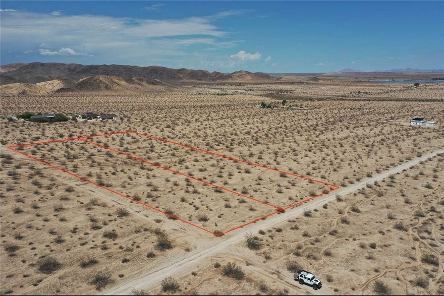scape to wide-open skies on Pearl Spring Avenue. These TWO 2.5 parcels are together to offer a 5-acre parcel in San Bernardino County. It sits on the quiet northwest edge of Twentynine Palms, with sweeping desert vistas by day and brilliant stargazing at night. Joshua Tree National Park is close by, and downtown Twentynine Palms is a short drive for dining, shopping, and everyday needs.

The setting is peaceful and low-density, yet convenient—ideal for a compact cabin, an architect-designed compound, or a distinctive off-grid retreat. It also offers easy access to the Marine Corps Air Ground Combat Center’s main gate. If you’re seeking a blank canvas to create your own desert haven—or a smart land investment—this property checks every box.