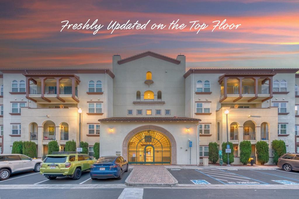 Introducing this exceptional 2-bed, 2-bath, 1,259-square-foot, single-level condo on the top (5th) floor of the meticulously cared-for Terra Serena Luna gated complex. This unit offers a tranquil courtyard-facing location and features an east-facing balcony. The open floor plan includes a spacious living and dining area, creating a perfect setting for comfortable living. The master bedroom serves as a luxurious retreat with its walk-in closet, double vanity, oversized soaking tub, and separate shower stall. This condo is packed with premium features: new top-quality SPC flooring, new kitchen sink & faucet, new carpet, fresh paint, new kitchen appliances, new ceiling fans, new recessed lights, and new light fixtures throughout. You'll also appreciate the convenience of an in-unit laundry room and central A/C and heating, along with two side-by-side parking spaces conveniently located next to the elevator. The complex has recently added EV chargers, providing a convenient and eco-friendly amenity for residents. It also offers a clubhouse, gym, swimming pool, jacuzzi, BBQ area, playground, courtyard, and elevators. HOA dues cover water, garbage, and insurance. The property is within walking distance of the Great Mall and light rail. Some photos have been virtually staged.