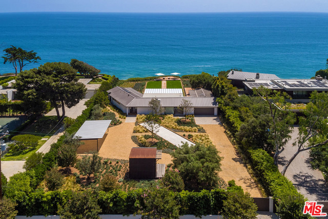On Malibu's prestigious Point Dume bluff top, this mid-century Ranch-style home w/contemporary interiors is located on a quiet cul-de-sac road w/beach access. Unstoppable 180º ocean views from every rm & wood flrs throughout features a huge great rm w/flr to ceiling glass windows w/high ceilings & wd burning FP. The dining area & gourmet kitchen of Caesarstone countertops is tied into the open floor plan. A wraparound wd deck & boardwalk lead to a cliffside lounge deck surrounded by a grassy lawn & drought tolerant low water consumption landscaping. The home offers a sun-filled owner's suite w/corner glass sliders & a luxe bath as well as a 2nd bdrm & separate GR w/private entrance. The front yard has a bocce ball court & a free-standing air-conditioned private office. The exterior architectural polycarbonate awnings block 90% of suns UV rays & decreases the heat index for comfortable outdoor living year round. Full site security includes laser beam technology & full camera coverage.