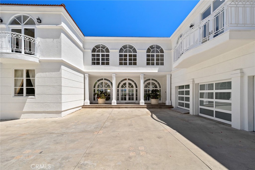 REDUCED REDUCED $635,000.
Nestled at the end of a private gated cul-de-sac in prestigious Glendale, 759 Foxkirk Rd represents an extraordinary opportunity to own over 5,700-square-foot architectural tour de force on nearly half an acre of meticulously landscaped grounds. This custom-designed estate, held by only its second owner for over two decades, offers an unparalleled combination of sophisticated luxury, breathtaking views, and ultimate privacy just minutes from downtown Los Angeles. From the moment you enter through the private gates, this Mediterranean-inspired masterpiece captivates with its soaring 30-foot ceilings in the marble entry foyer and a magnificent grand spiral staircase that serves as the home's centerpiece. For ultimate convenience and accessibility, a private elevator provides seamless access between all levels of the home. Nearly every room frames panoramic vistas of downtown Los
Angeles and Glendale, creating a living gallery where city lights become your evening entertainment and mountain backdrops define your daily experience. The main level flows seamlessly for grand-scale entertaining, featuring 21-foot ceilings in the living room, dining room, and family room. Floor-to-ceiling windows throughout maximize the spectacular views while flooding interiors with natural light. Rich hardwood floors and imported marble stone create an elegant foundation throughout, reflecting the impeccable attention to detail that defines this property.The spectacular master suite offers a true retreat with panoramic views from every window, creating a sense of floating above the city. The suite features a cozy fireplace for intimate evenings, a luxurious jacuzzi tub for ultimate relaxation, and an expansive walk-in closet that rivals the finest boutiques. Every detail has been carefully considered to create a private sanctuary within this exceptional home.The newly remodeled pool and spa create a private resort experience in your own backyard, perfectly positioned to capture both mountain and city views. The outdoor spaces have been designed as natural extensions of the interior living areas, providing multiple venues for alfresco dining, poolside relaxation, and outdoor entertaining against the dramatic backdrop of the Verdugo Mountains.