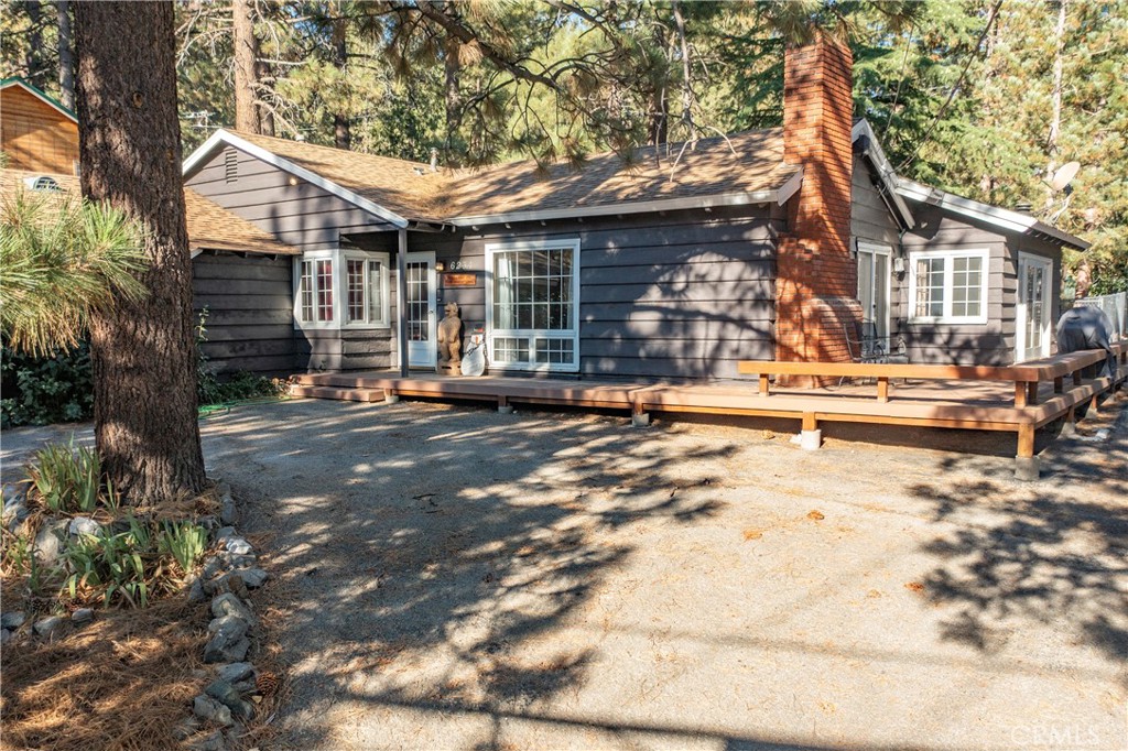 Don't miss out on this great opportunity to purchase your Mountain home in the beautiful City of Wrightwood and just minutes to a famous Ski Resort. The home is turn-key with, 3 bedrooms, 2 bath, 1,918' sqft. spacious living space and on a flat 20,000' sqft. approximately 1/2 acre lot, which is hard to find in this sought out neighborhood. Step out to the spacious rear lot with forest like views and fully enclosed with a large shed which can be used as a work shop or storage with plenty space. You have plenty of parking for a boat or large R.V. and not to mention a built-in brick BBQ area and a concrete slab perfect for a spa. Inside you will love the open beam extra large family room approximately (20 X 22) with carpet over hardwood floors, free standing wood burning fireplace and French doors leading to a wrapped around wooden deck. The kitchen has been upgraded with tiled back splash and stainless steel appliances with continued hardwood floors from the entry. The Living room also has open wooden beam ceiling and a beautiful brick fireplace. Too many great things about this home to list. This is a must see!
