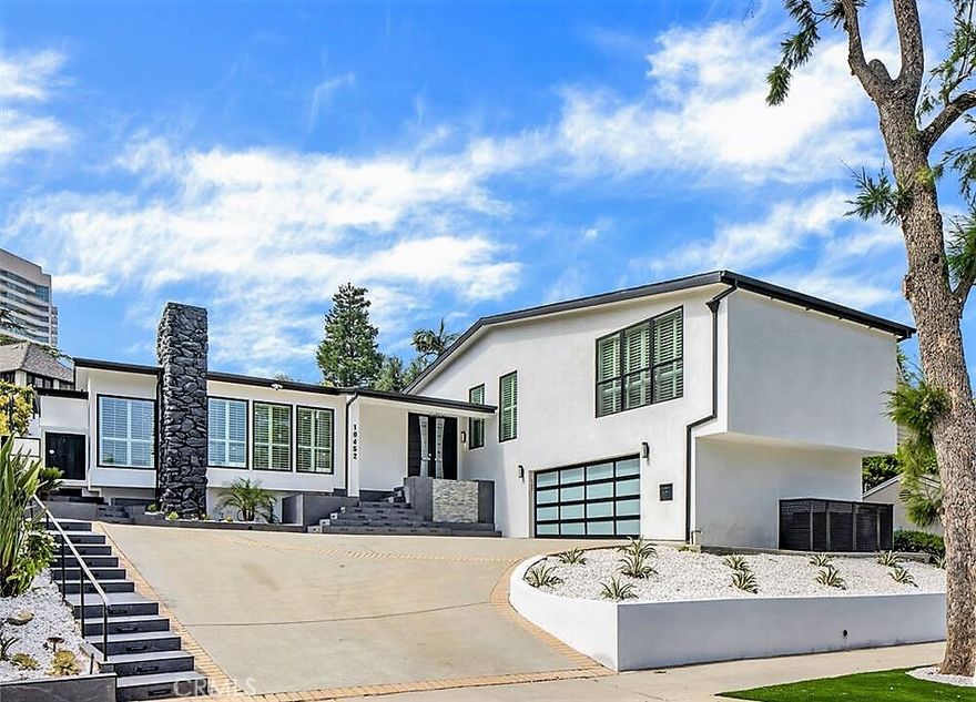 Settle into luxury living in a completely re-imagined single-family residence located in the beautiful and prestigious Prime Little Holmby neighborhood, just moments from Holmby Park and UCLA. This bright home features high ceilings, an excellent open floor plan, 3 Bedrooms, and 5 Bathrooms, with the Living Room (and fireplace) flowing seamlessly into the Dining area and the large chef's kitchen. Both the kitchen and the Family Room open directly to the private backyard for easy entertaining, while the luxurious Primary Bedroom offers a true retreat with its own fireplace, walk-in closet, and a spa-like bath featuring a soaking tub and separate shower, all opening to the backyard. Completing this remodeled residence are two additional bedrooms, each with a private en-suite bath, a powder room, and a separate laundry room. Two-car garage attached.