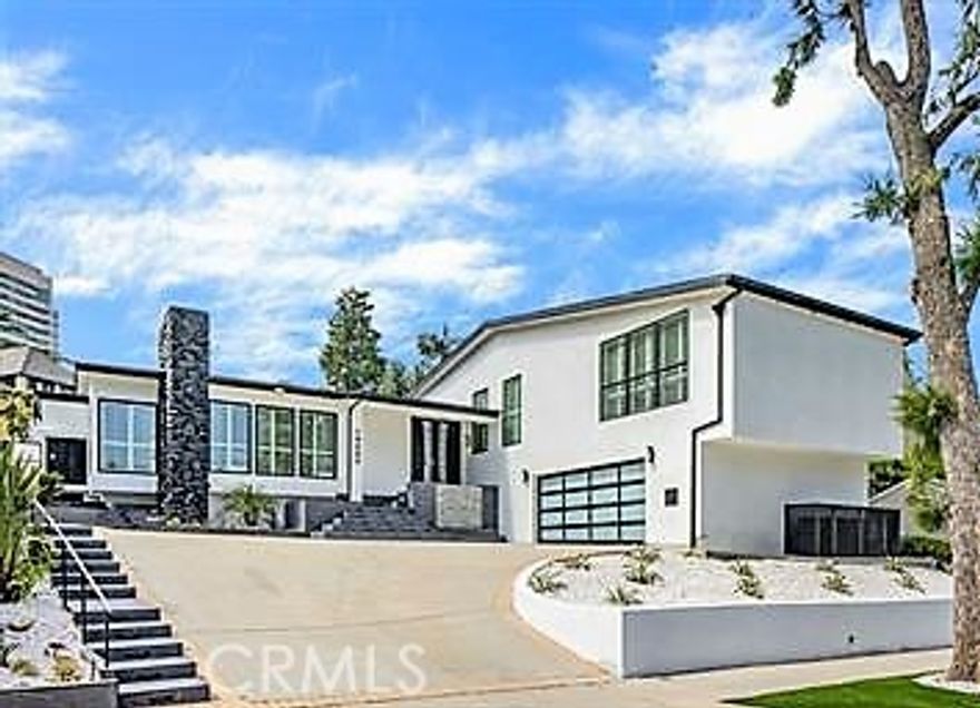 Settle into luxury living in a completely re-imagined single-family residence located in the beautiful and prestigious Prime Little Holmby neighborhood, just moments from Holmby Park and UCLA. This bright home features high ceilings, an excellent open floor plan, 3 Bedrooms, and 5 Bathrooms, with the Living Room (and fireplace) flowing seamlessly into the Dining area and the large chef's kitchen. Both the kitchen and the Family Room open directly to the private backyard for easy entertaining, while the luxurious Primary Bedroom offers a true retreat with its own fireplace, walk-in closet, and a spa-like bath featuring a soaking tub and separate shower, all opening to the backyard. Completing this remodeled residence are two additional bedrooms, each with a private en-suite bath, a powder room, and a separate laundry room. Two-car garage attached.