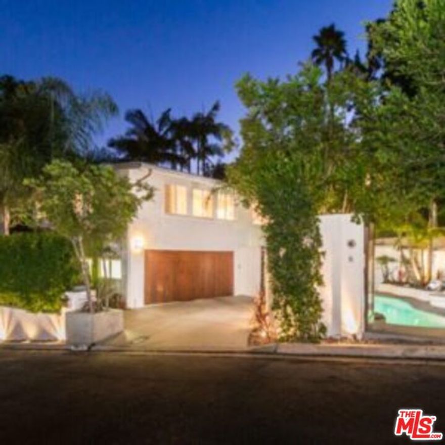 Best quality home on the market in this price point. Located in prime Beverly Hills at the end of a quiet cul-de-sac, lies this magical Mid Century retreat. Featuring a bright, open floor plan with excellent indoor/ outdoor flow. This former home to several A-List celebrities is an entertainment delight. Private, walled and gated entry with lush, California landscaping. Upon entry, the home features unique architectural detailing and one-of-a-kind elements. Spacious, light-filled living & dining area set atop the trees. Beautiful Kitchen remodeled in 2018 with porcelain counters, custom cabinetry, & top of the line MIELE appliances. Large sumptuous Primary Suite w/ luxuriously appointed bath, and 2nd bedroom both feature walls of glass which open to a 50 ft. cascading waterfall, Koi pond, lush yard and fire pit, with trails leading to hilltop lounge area. Downstairs features a sun-filled 3rd bedroom w/ separate gated entrance, perfect for guests, office or live-in. Media Den with built in bar, wine fridge, and sunken circular "conversation pit", perfect for movie nights or intimate conversations, opens to heated pool and BBQ area . Private and Tranquil with only 3 homes on street and ample parking rarely found in the hills. Located within minutes of Los Angeles' best restaurants, shopping and nightlife. Perfect for the Entertainer or Executive. An absolute gem. Last several years, usually leases over $19.5k long term. Usually leases quickly. Priced to Lease