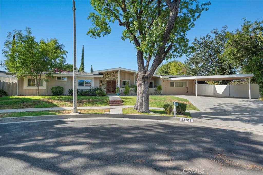 Welcome to this beautifully reimagined Charles DuBois home in Woodland Hills, adjacent to Calabasas and Hidden Hills, set on a peaceful tree-lined cul-de-sac on an incredible lot! Featuring 4 bedrooms and 2 bathrooms, this timeless mid-century gem has been thoughtfully updated. Step inside to find a bright, open layout with the living, dining, and family rooms flowing seamlessly together. Enjoy the comfort of recent upgrades throughout: new flooring, remodeled Jack & Jill and primary bathroom, refreshed closets, newer laundry, water heater, and new HVAC system. The backyard is an entertainer’s dream with new turf, pavers, and a sparkling pool that’s been replastered and enhanced with new coping, plumbing, lighting, baja shelf, pool fence (if needed), and solar heated pool. Owned solar panels, plus a newer roof (2023) with cool shingles, foam insulation, and gutters, added for long-term value and efficiency. The attached garage has been converted into a versatile bonus space—great as a home office, gym, storage or creative studio. Located minutes from award-winning schools (zoned for Lockhurst, Hale and El Camino), parks, and Ventura Boulevard’s shopping and dining, this move-in ready home blends mid-century charm with modern comfort.