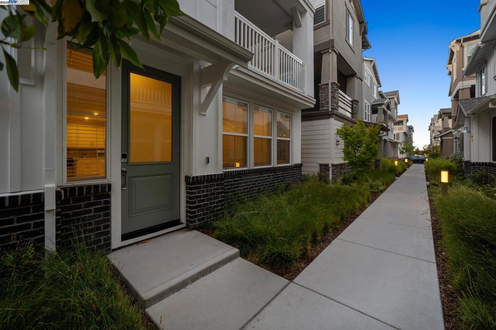 Newly constructed in 2023, this rare Bridgeway home combines a versatile 2-story layout with a private third-floor master retreat—designed for space, comfort, and flexibility. Secluded on its own level, the spacious top-floor suite offers a peaceful sanctuary with an oversized balcony and a massive 200+ SqFt walk-in closet. Just one level below, you'll find three spacious bedrooms—including one with its own en-suite bath and double closet—alongside a versatile recreation room, laundry room with the best and biggest LG washer/dryer money can buy, and a second large balcony for seamless indoor-outdoor flow. The first level features an open kitchen equipped with GE’s newest appliances that connects to the dining area and great room, along with a convenient half bath and direct garage access. The backyard is beautifully finished with paver stones, and the home includes a full soft water system and reverse osmosis drinking water filter—adding comfort and ease both inside and out. Wide staircases, thoughtful separation, and abundant natural light make this layout ideal for multi-generational living, privacy, or work-from-home flexibility. Enjoy parks, trails, and playgrounds in Bridgeway—just minutes from Meta, Tesla, I-880, and Dumbarton Bridge.