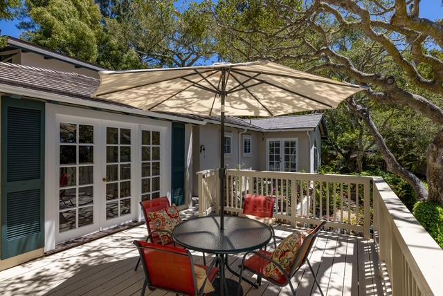 Fantastic Carmel-by-the-Sea cottage located on a very quiet street. Ideally located just a few blocks from downtown Carmel shops and restaurants and a short stroll to the beach, you get what most people want, easy access without the traffic. Known as Second Chance Beach House, this spacious 3 bedroom 4 bath home is set on a nice 5275 square feet lot and offers views of the forest. As you enter the residence, you are greeted to refinished oak hardwood covering the living and dining room floors and high open beams ceilings and a brick fireplace. The kitchen has updated appliances and is open to the cozy family room which features a beautiful Carmel stone fireplace to take chill out of a foggy evening. All three bedrooms are very spacious and have dedicated bathrooms. Other amenities include a carport, a 4th full bath, and approximately 800 square feet of outdoor deck/patio space. This home is perfect to use as it is, or to come in and remodel to taste. Either way you will love the sounds of the ocean and the proximity to everything Carmel-by-the-Sea has to offer from this fantastic Carmel location.