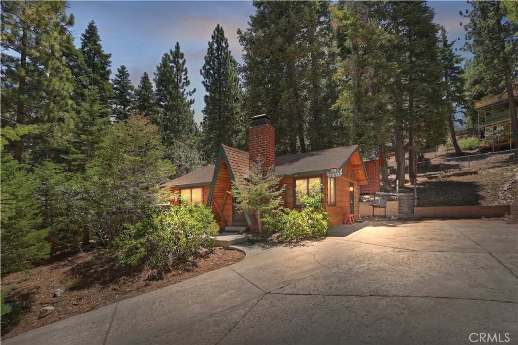 Welcome to your cozy mountain escape in the heart of Moonridge! This classic A-frame cabin with ranch-style extensions offers privacy, charm, and the true Big Bear experience. This 2-bedroom, 1-bath home is being sold fully furnished—including all furniture, décor, and a private hot tub—making it completely turnkey for a vacation home or short-term rental.
Inside, enjoy rustic wood details, a welcoming brick fireplace, and an open living area perfect for relaxing after a day on the slopes. Step outside to a spacious deck ideal for entertaining or enjoying peaceful forest views.
Conveniently located near Bear Mountain Resort, the golf course, the zoo, and Big Bear Lake. Whether you’re looking to generate rental income or enjoy your own peaceful retreat, this Moonridge cabin is move-in ready and full of potential.
Don’t miss this opportunity!