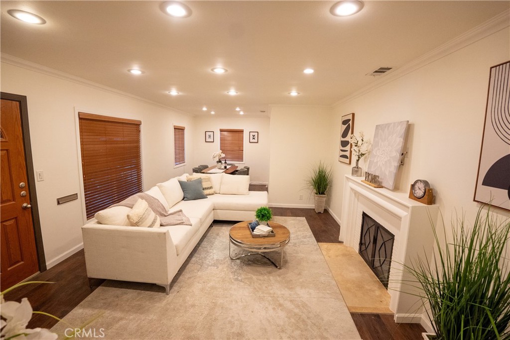 Welcome to this single-family home on a quiet North Hollywood street. Featuring 3 bedrooms, 2 bathrooms, and a versatile BONUS SPACE —perfect as a home office, playroom, or extension of the master bedroom—this single-level home combines comfort and style. Enjoy HARDWOOD floors throughout, a cozy fireplace for relaxing evenings, and a remodeled kitchen and bathrooms. Step outside to discover ample space for outdoor entertaining, a large, dedicated laundry room with abundant STORAGE and CABINETS, and a detached TWO-CAR garage that adds extra flexibility to the property. Lovingly cared for by its family for 40+ years, this home captures the laid-back NoHo vibe while remaining close to shops, dining, and the NoHo Arts District. Don’t miss the opportunity to make this warm and inviting home yours!