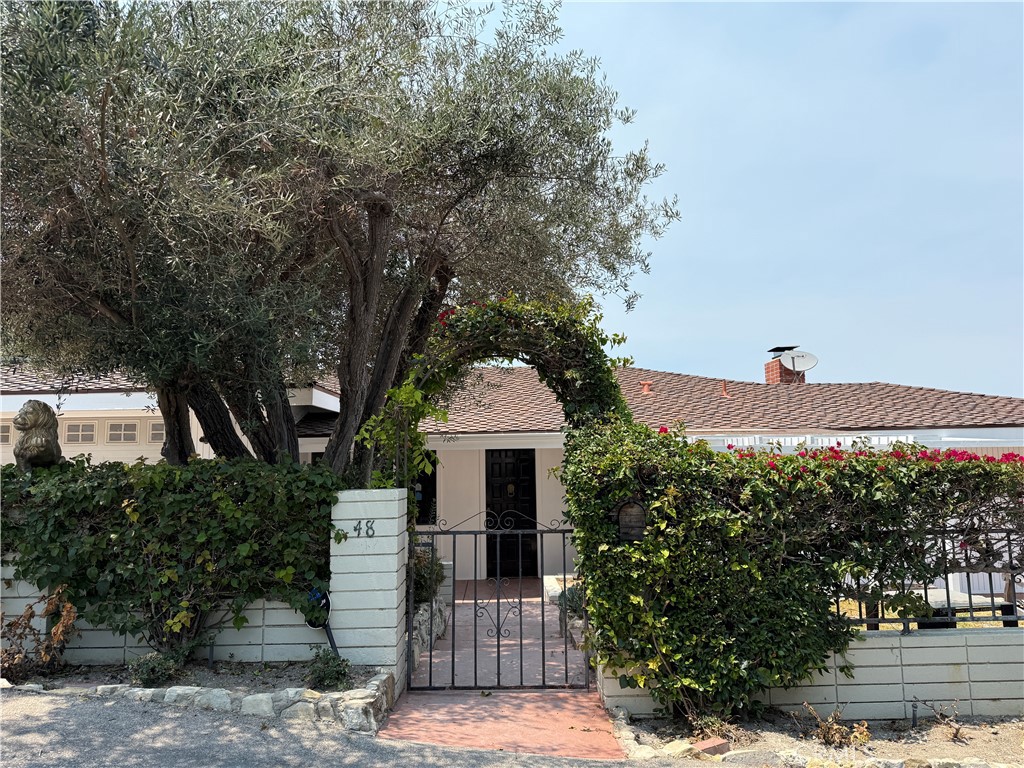 Tucked away behind a valley on a quiet street is this beautifully updated home. Enter to an open living and dining room with a dramatic large windows overlooking the verdant city of Los Angeles and harbor view. The primary master bedroom is expansive with a double open doors that leads to a deck with breathless view of the city. In addition, the master bathroom have been remodeled and upgraded to a luxury look like no other. Three additional bedrooms and one full bath are located at the lower level of the property. The back outdoor deck space is quintessential California living with multiple spaces for entertaining. The property includes an outdoor hot tub, perfect for relaxing and enjoying the sunny days. It's a must see property and make this resident as your sweet home.