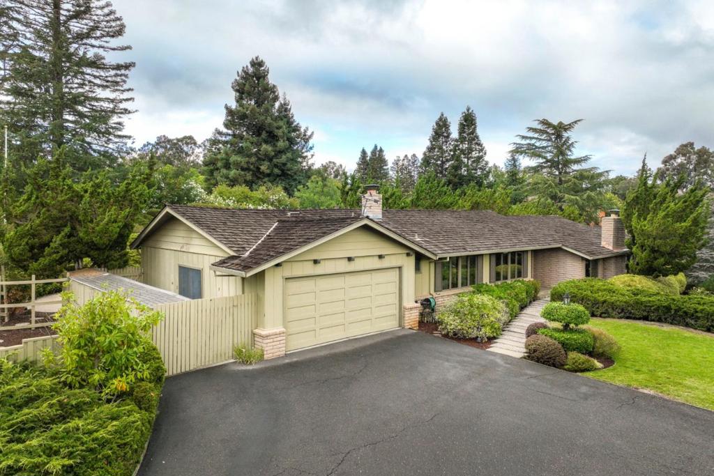 Discover this incredible opportunity to own a private retreat just moments from vibrant downtown Los Altos. Situated on nearly an acre, this beautifully landscaped property features lush front and back lawns, mature plantings, and a sparkling pool, perfect for entertaining or quiet relaxation. The spacious 4-bedroom, 2.5-bath home offers a thoughtful floor plan with natural light throughout. The primary suite is a true haven with a generous walk-in closet. Multiple living areas provide comfort and versatility, while the seamless connection between indoor and outdoor spaces creates an ideal California lifestyle. Enjoy the convenience of a short stroll to restaurants, shops, and amenities, while still tucked away in a serene, private setting. This is Los Altos Hills living at its best.