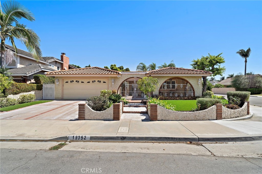 Welcome to this highly sought-after Goldenwest Estate single-story home nestled on a prime 7,200 sq ft corner lot just minutes from the beach. With 3 bedrooms, 2 bathrooms, and approximately 1,765 sq ft of living space and paid-off solar panels installed 2016! Step through the gated front courtyard, an inviting space perfect for morning coffee or quiet evenings, and into the spacious open-concept floor plan. The living space is lined in Mexican style tile and creates continuity of indoor and outdoor living. Vaulted ceilings and skylights fill the large living room with natural light, while an arched fireplace creates a warm centerpiece for gatherings. The adjacent family room / flex space is ideal for a home office, playroom, or hobby area, giving you the flexibility to make the space your own. The generous kitchen granite countertops, new gas range cook top, tons of work space including a separate utility sink. The kitchen and dining room provide plenty of room for customization and flow seamlessly to the outdoor living area, making this home an entertainer’s dream. Step outside to your private backyard retreat featuring lush landscaping, a covered patio, and a built-in BBQ served by natural gas — perfect for hosting evening dinners or weekend get-togethers. Beyond the main yard, you’ll find unique features that set this property apart: a gated RV driveway with electric gate, a work shed equipped with electricity, and even a wine-making shed along with fruit producing mandarin orange, lime and persimmon trees. You'll find a large side yard perfect for gardening or playset, the possibilities are endless! - truly a rare find. Inside, all three bedrooms are generous in size, while the primary suite offers direct access to the backyard, a spacious walk-in closet, and a custom bathroom complete with a Japanese style bathtub and shower. Additional highlights include central A/C, dual pane windows and sliders, new roof 2016, termite tenting Aug. 2025 and direct garage access with laundry hookups for ultimate convenience. Located on a quiet interior street, this home offers the perfect balance of comfort and convenience. Enjoy being within walking distance to the neighborhood park, just a short drive to world-class beaches, and minutes from top-rated schools, shopping, dining, and entertainment.