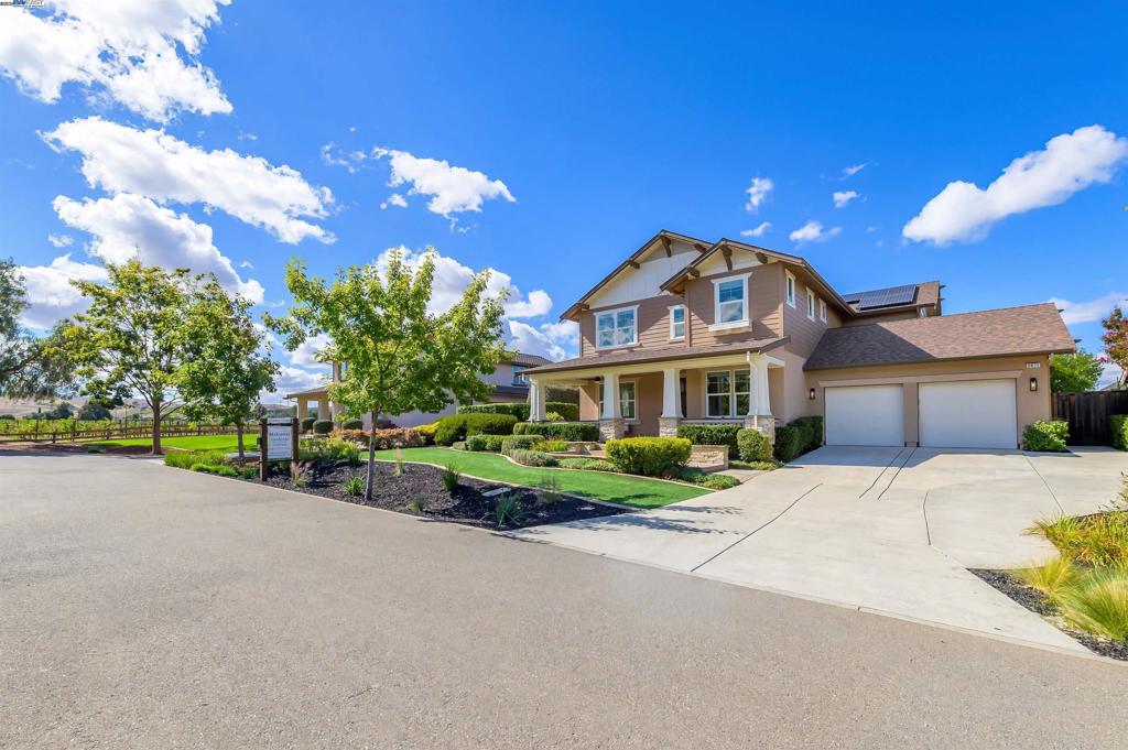 LOCATION, LOCATION, LOCATION! Don't miss this rare property with UNOBSTRUCTED 360° VINEYARD VIEWS. From the moment you step through the front door you’re greeted by sweeping panoramas of Livermore’s iconic wine country. This tech forward home features OWNED ELECTRIC solar with 2 Tesla Power walls, OWNED POOL SOLAR, and wi-fi enabled controls to irrigation, HVAC and security systems. The backyard is a private resort oasis, showcasing a lagoon-style pool & spa, and full outdoor kitchen complete with built-in BBQ, pizza oven, refrigerator, sink and large bar. You can sit back and relax under the motorized pergola and enjoy outdoor living at its finest with a fully permitted backyard bathroom, temp. controlled bonus room, and 498 sq ft of covered patio's. You will not want to miss the chef inspired kitchen with Wolf range, pot filler, wine fridge and oversized island with leathered finish. Functional floor plan with 1 BED & BATH DOWNSTAIRS, upstairs laundry, office area and oversized open loft or 5th bedroom. Retreat to primary suite with expansive built-in closet cabinets and stunning views of vineyards and hills!! Garage is fully finished with epoxy floors, and abundant storage racks and tool cabinet. DO NOT MISS THIS ONE OF A KIND ONE OWNER HOME!!!