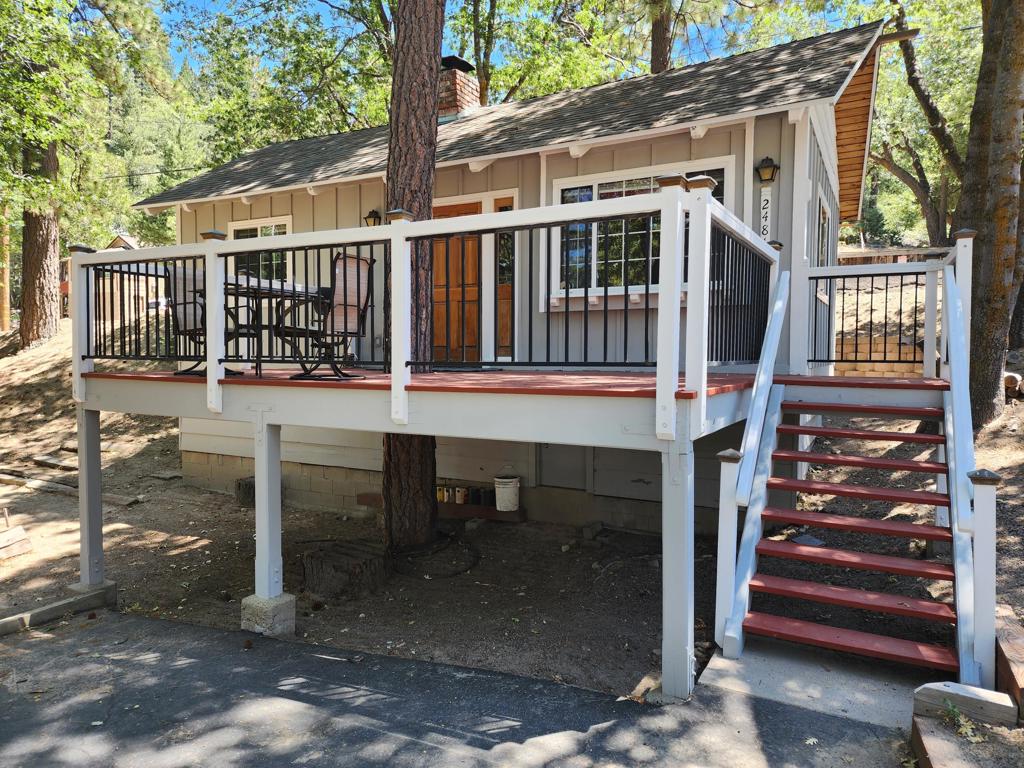 Discover your perfect mountain getaway in this cozy 1-bedroom, 1-bath cabin on a corner lot in Arrowbear. Just up the road from Arrowbear Lake and Park, this furnished retreat offers easy access to year-round adventure--ideally located between Lake Arrowhead and Big Bear for skiing, hiking, and exploring. Inside, you'll appreciate newer copper plumbing, a newer roof, water heater, and dual-paned windows--giving you peace of mind and energy efficiency. The large front deck is great for gatherings under the stars. The property also includes 3 additional lots, providing space, privacy, and future possibilities for expansion. Ideal for a weekend escape or a smaller full-time residence, this charming, cabin is an excellent opportunity to own a slice of the mountains, at an affordable price.