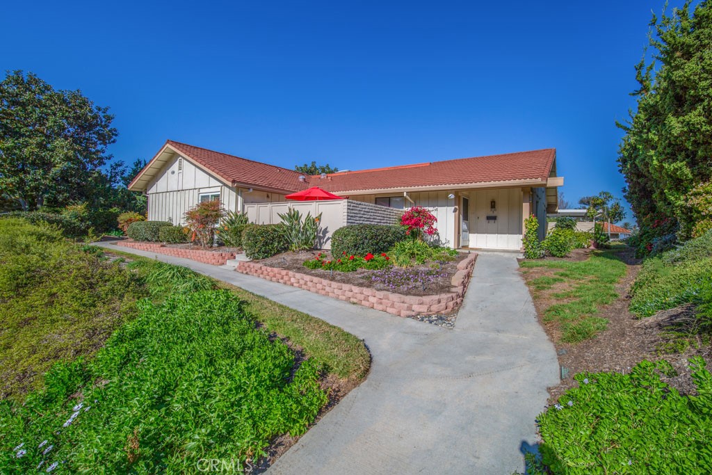 Private location with easy access NO ABOVE OR BELOW and NO STAIRS!! Located in Laguna Woods Village, a 55+ Active Senior Community. Light and bright and ready to move into this “Encanto” model. Conveniently located close to Gates 7 & 8, shopping, restaurants, close to your covered carport plus street parking right in front with NO STAIRS! The unit features 2 spacious bedrooms, 2 bathrooms, side by side washer and dryer, central air and heating and a wonderful patio area for entertaining that makes the best of outdoor living. This home has been recently updated with a new kitchen, updated bathrooms and ready for you to enjoy all the amenities that Laguna Woods Village has to offer! Centrally located for you to enjoy the 27 hole championship golf course or the 9 hole executive par 3 course, tennis, paddle tennis, lawn bowling, pickleball, 2 fitness centers, 7 clubhouses, 5 swimming pools, equestrian center, woodshop, clubs and plenty of fresh air. Plus free bus transportation around the community.