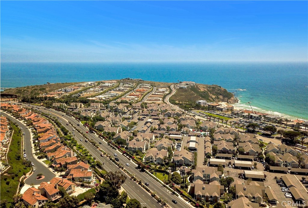 Welcome to your GORGEOUS REMODELED Dana Point coastal oasis at Niguel Beach Terrace—just steps from the sand to Strands Beach & Park! This RARELY ON MARKET, ULTRA DESIRABLE UPPER LEVEL END UNIT is the ultimate beachside gem. Located in one of Dana Point’s most desirable ocean-side-of-PCH Communities. Soaring high vaulted ceilings, no one above, private & peaceful interior location within Community - away from busy beach traffic/public trail/pool & spa. As you step inside you will immediately see that NO expense was spared—enjoy floor-to-ceiling coastal modern upgrades throughout - open concept layout, extra light, bright & breezy all year-round. With dual paned windows, recessed lighting, expanded/opened up Kitchen with bold black granite countertops, large center island, coastal-modern cabinetry with pull out pot/pan drawers, large pantry, upgraded stainless steel appliances—perfect for entertaining or everyday beach living. Enjoy not just one, but TWO large balconies - ideal for dining al fresco, morning coffee & evening ocean breezes. Two oversized bedrooms - upgraded modern closet doors, generous storage space in bedrooms + bathroom + balconies. Two absolutely stunning bathrooms with quartz countertops, designer tilework, sleek & modern. Private laundry conveniently located on balcony. Easy parking with nearby covered carport + plenty of guest parking available. Entire Community recently re-piped all units with brand new PEX. HOA amenities include - year-round heated Resort-style pool/spa + second spa area, Clubhouse for private events, EV charging stations, greenbelts. All this just steps from World Class beaches, surf spots & scenic walking trails. Explore the famous Headlands Conservation Area, enjoy a short stroll or bike ride to the vibrant Lantern District, dine at some of OC’s best Coastal restaurants. The newly renovated up-and-coming (in progress) Dana Point Harbor & Marina is just down the road—offering whale-watching excursions, Harbor cruises, paddleboarding, fishing, day trips to Catalina Island. Ride the free Dana Point Summer Trolley up & down the Coast, connecting to Laguna Beach’s art scene, San Clemente’s surf spots & San Juan Capistrano’s charming Historic District. Niguel Beach Terrace is the place to be—surrounded by 5-Star Resorts, the Ritz-Carlton, Waldorf Astoria Monarch Beach & the Links Golf Course. Live the ultimate Southern California beach lifestyle year-round ~ Welcome home!
