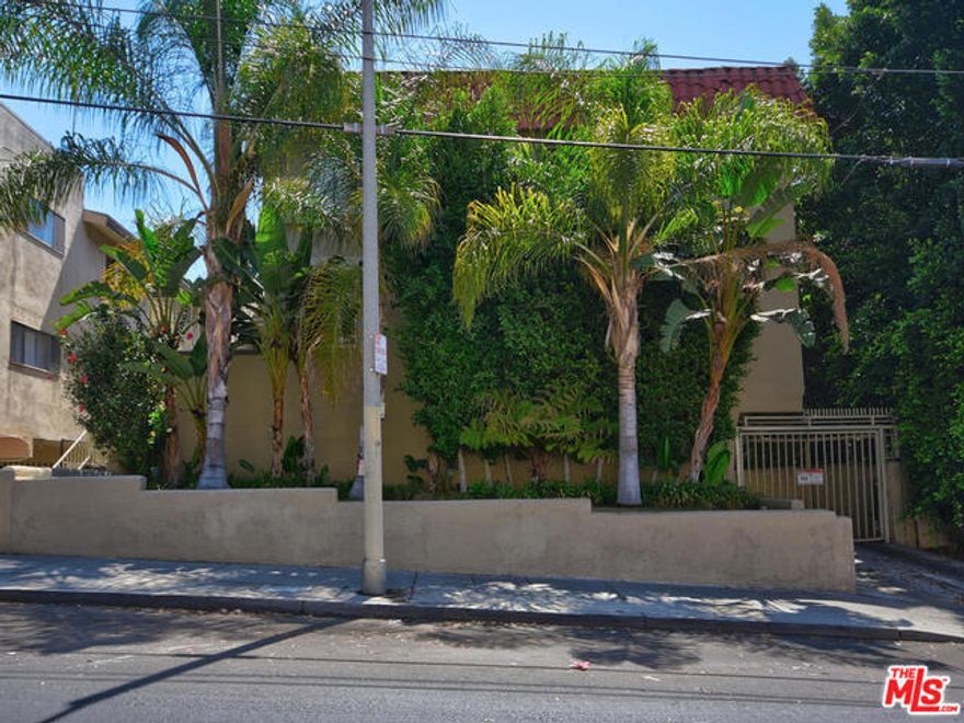 Prime location located just north of Sunset, adjacent to Rock and Roll Ralph's, down the block from Runyon Canyon and blocks from Hollywood and Highland. Easy access to public transportation.  Gated entrance and garage. Elevated first floor studio with a parking space. Enter into the living area and through a hall with bath off the hall and the kitchen beyond the hall. PHOTOS of a unit of the same size and layout.