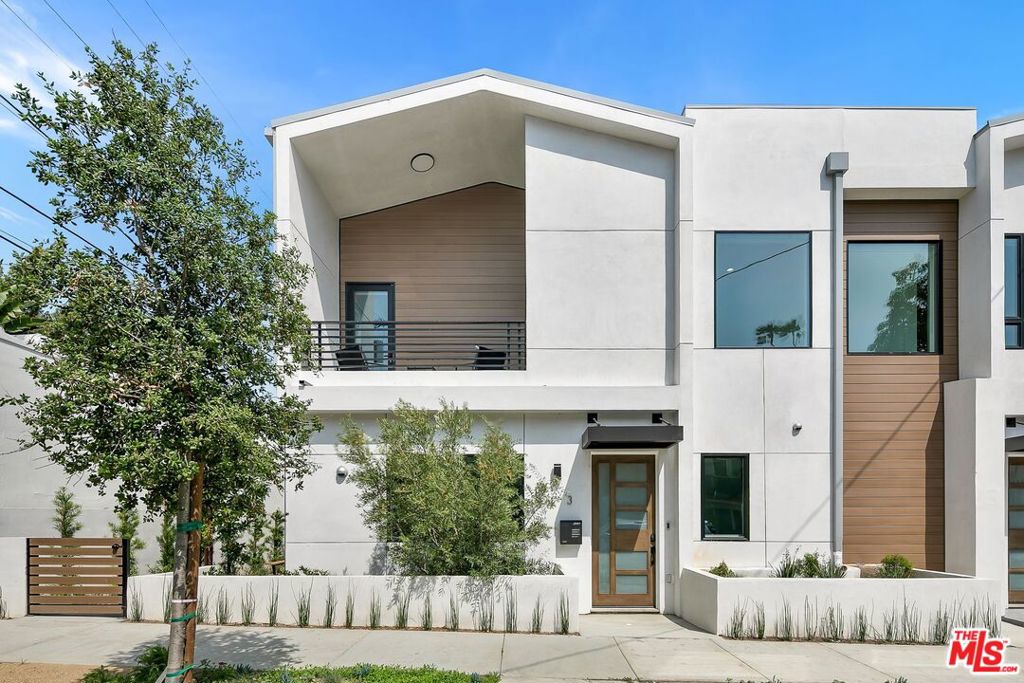 FULLY-FURNISHED, FULL-EQUIPPED. AVAILABLE FOR SHORT AND LONG STAYS brand-new construction in a central West Hollywood location! Walk through the front door to the living space. Relax on the couch and watch your favorite streaming service or local channel on the large flat-screen TV. Cook a meal in the large kitchen with stainless-steel Thermador appliances. Enjoy your food at the gorgeous kitchen island with bar stool seating for 4, or gather in the dining area with a dining table and seating for 6. The first bedroom is situated next to the living room on the first floor, making it easily accessible for anyone. Rest on the Queen bed and enjoy the spa-like attached bathroom with 2 sinks and a shower. Head up the stairs to find the Master suite with a King bed, Smart TV, spacious walk-in closet, and private balcony with lounge furniture. The attached Master bath offers 2 sinks and a shower. Both bedrooms provide room-darkening shades for the best comfort and sleep possible. Step outside to the private patio and enjoy a snack under the tress at the picnic table. The unit offers garage parking for 2 vehicles and laundry room with a washer and dryer. Recessed lighting and hardwood flooring found throughout the home.