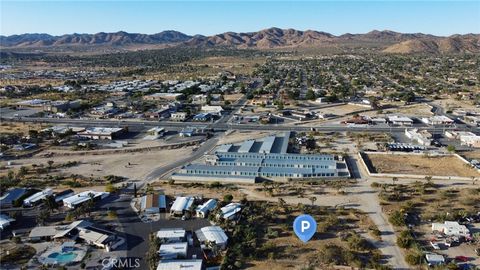 Photo of 771 Scarvan Road, Yucca Valley, CA 92284 (MLS # HD26045957)