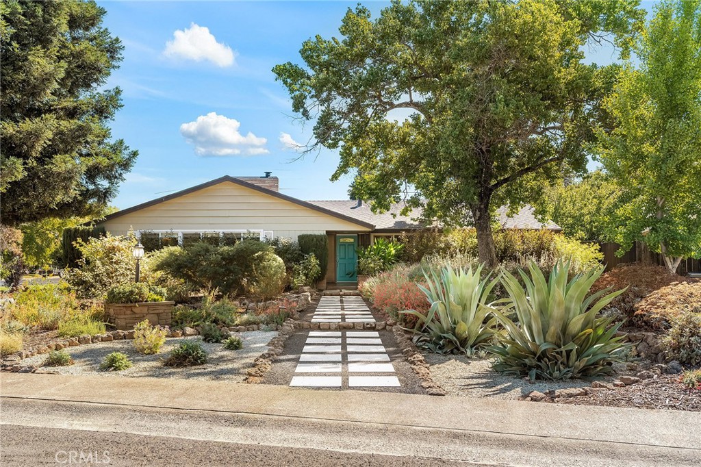 Mid-Century Modern Charm with Pool, Owned Solar, RV Parking & more! This stunning 3 bedroom, 2 bath home with an office or bonus room is full of character and modern upgrades that make it truly special. Located in a desirable Chico neighborhood with a convenient central location, this stunning mid-century modern home offers the perfect blend of comfort, convenience, and timeless design. From the moment you arrive, you’ll appreciate the curb appeal, the lush, fully landscaped front and back yards featuring a mature apricot tree, 2 avocado trees, raised garden beds, and RV parking with full power and hookups, making it easy to welcome guests or store your toys.
Inside, you’ll find an inviting floor plan filled with natural light from large picture windows that showcase the home’s warm and welcoming feel. Beautiful hardwood floors flow throughout the main living areas, while newer patterned tile adds style and elegance to the kitchen and baths, creating a perfect balance of warmth and sophistication. The spacious living room features a cozy gas fireplace, ideal for relaxing evenings or entertaining guests. The remodeled kitchen offers new quartz countertops, newer stainless steel appliances (all included), an eating bar for casual dining, and tile flooring that ties the space together beautifully. Every detail of this home has been thoughtfully enhanced, with upgrades that include a newer water softener, tankless water heater, whole house fan, and OWNED solar for energy efficiency and peace of mind.
Step outside to your private oasis, an entertainer’s dream complete with an in-ground pool and built-in hot tub. The breezeway connecting the home and garage adds both charm and functionality, creating the perfect spot to relax in the shade or enjoy poolside gatherings. The fully landscaped yard is ready for your outdoor lifestyle, from gardening to weekend barbecues. With its desirable location, stylish updates, and unmistakable mid century modern appeal, this home offers the perfect balance of character, efficiency, and everyday comfort.