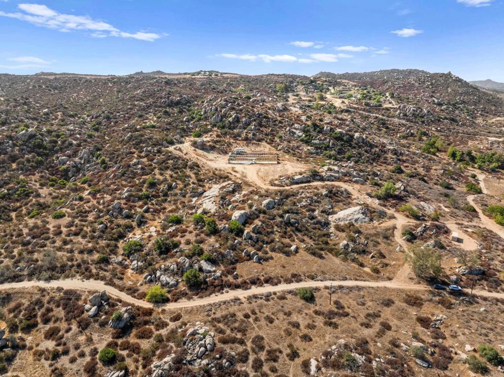 Discover wide-open space and endless possibilities with this 10-acre parcel in Nuevo, CA. Set against the backdrop of rolling hills and sweeping vistas, the property offers breathtaking views and the rare advantage of being surrounded by conservation land, ensuring lasting privacy and natural beauty. Practical improvements are already in place, including water storage tanks and multiple greenhouses, making this a fantastic opportunity for agriculture, sustainable living, or creating your own private retreat. Whether you dream of building a custom home, expanding farming operations, or holding as an investment, this land provides the flexibility you’ve been looking for. Don’t miss your chance to own a piece of land with both functionality and natural beauty in one of Riverside County’s most serene settings.