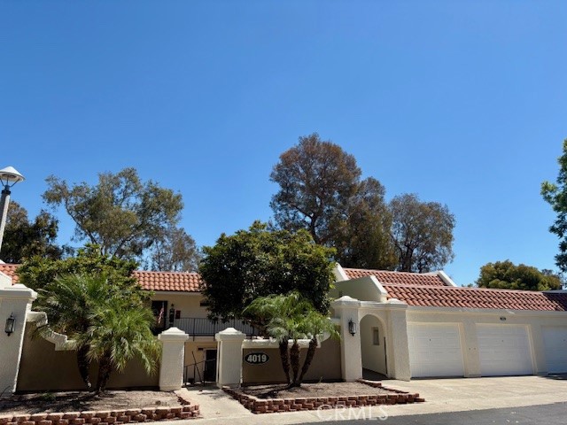 Spectacular panoramic east-facing view of the golf course, city lights and Saddleback mountains from the wide balcony of this upper end-unit Casa Milano. The view can also be enjoyed from the living room, dining room and kitchen. Over 1200 square feet of living space with a spacious living room and two large bedrooms. Full-size washer-dryer units are conveniently located in a hall closet. Upgrades include central HVAC, dual-pane windows, smooth ceilings and crown molding. This residence has brand new carpeting and has been freshly painted. Both bedrooms feature plantation shutters and mirrored closet doors. This upper floor residence is easily accessed via a ramp (no stairs!). The detached one-car garage has extra storage. Do not miss this terrific rental opportunity in the Laguna Woods senior community!